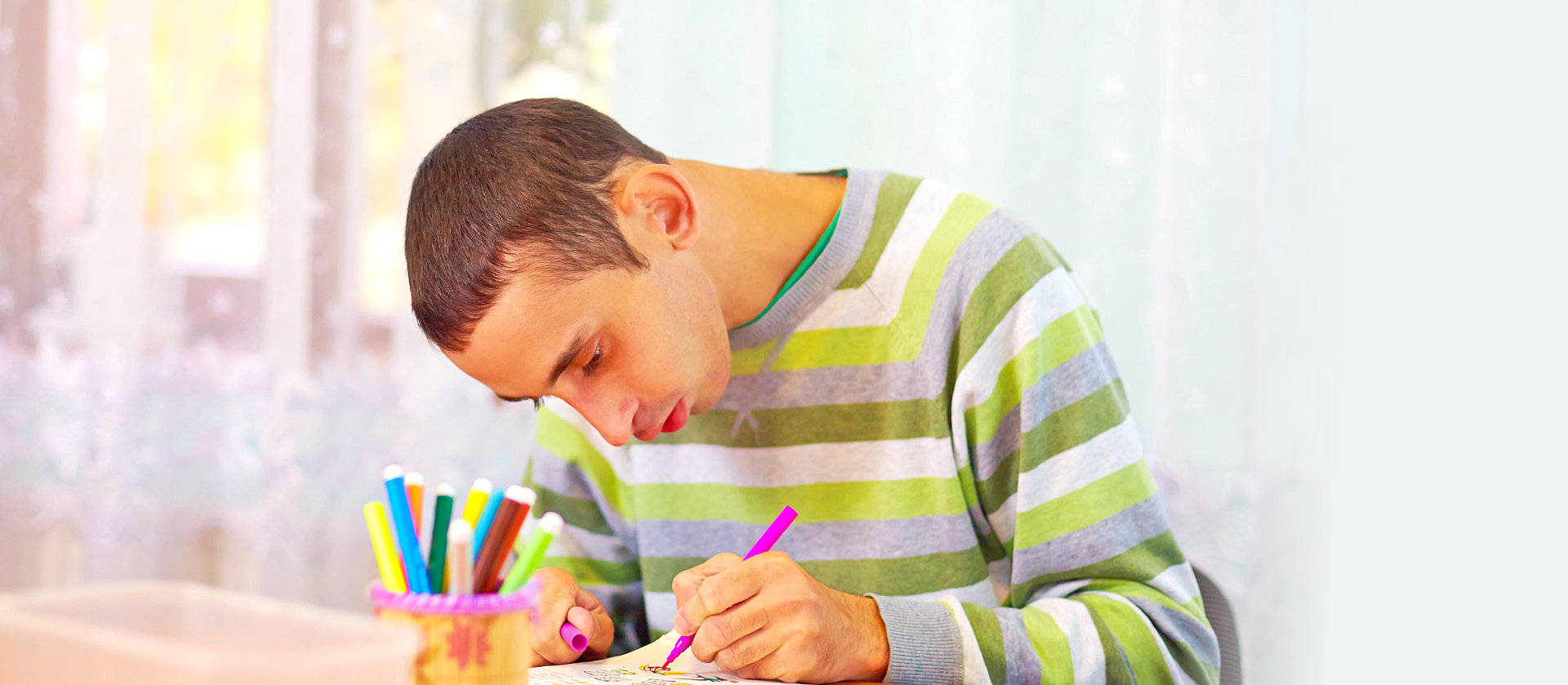 young man doing art